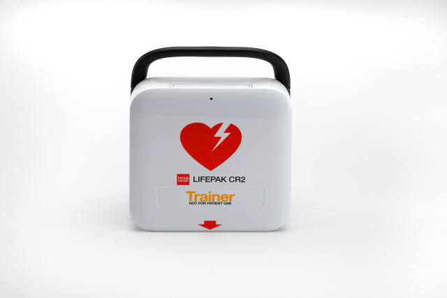 White Lifepak CR2 training defibrillator with Black carry handle and red defibrillator universal heart logo.