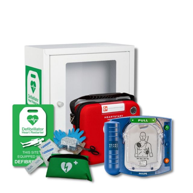 Image of the Philips Heartstart HS1 Defibrillator package available from Defib Store, which includes a white indoor AED cabinet, a slim carry case, an indoor AED wall sign, and a patient preparation kit. The white cabinet provides a secure storage solutio